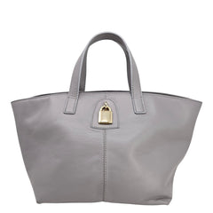 Light grey leather lock tote bag with gold lock clasp and top handles