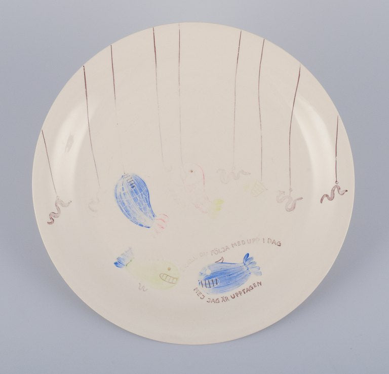Stig Lindberg for Gustavsberg. "Löja" plate. Hand-painted with a fish motif. Satirical illustration with Swedish text.