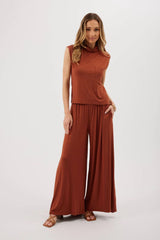 MODEL WEARING NUTMEG TOP AND PANTS