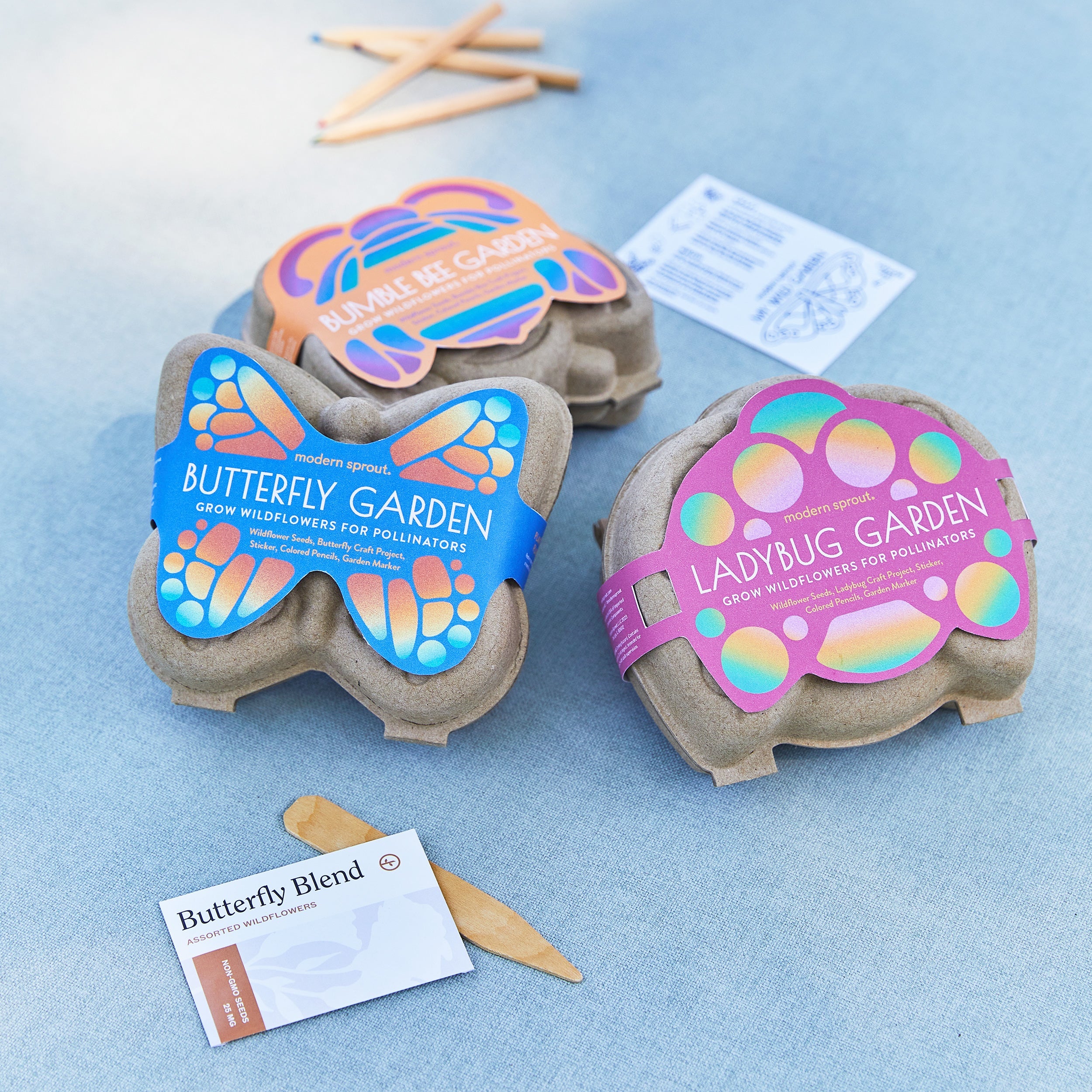 Curious Critters Garden Kits featuring Butterfly, Bumblebee, and Ladybug designs for growing wildflowers for pollinators.