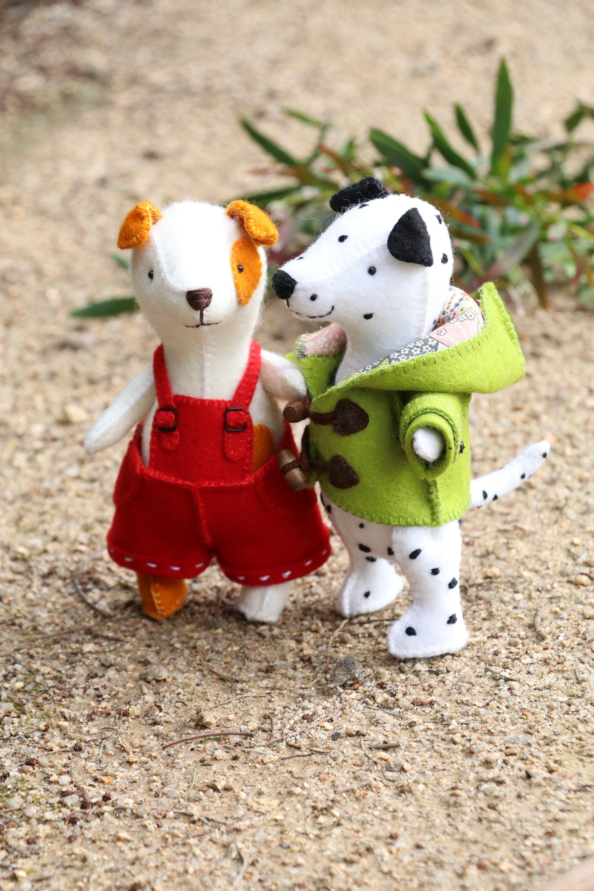 Daryl & Russ: Dog PDF sewing pattern featuring hand-sewn dogs in colorful outfits made from wool felt.