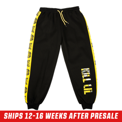 Black sweatpants with bold yellow "KILL LIL" text featuring an anime character graphic inside the letters.