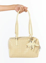 LEWKIN Vegan Leather Shoulder Bag With Keychain CU517 in yellow, hand-held product shot showing woven faux leather body, star-shaped keychain charm with silver eyelets, and dual top handles.