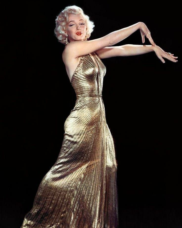 Marilyn Monroe on Instagram: “Marilyn wearing the stunning gold lamé dress created by Travilla for 'Gentlemen Prefer Blondes' in 1953. The dress barely appears in the…”
