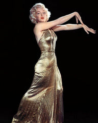 Marilyn Monroe on Instagram: “Marilyn wearing the stunning gold lamé dress created by Travilla for 'Gentlemen Prefer Blondes' in 1953. The dress barely appears in the…”