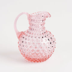 Hobnail Glass Pitcher in Petal Pink on a white background at Addison West