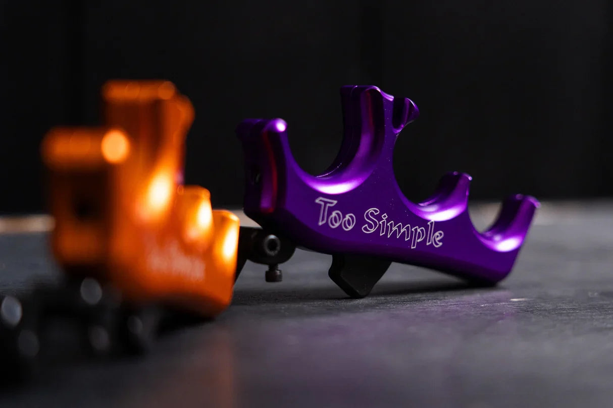Carter Too Simple thumb trigger release in purple — ergonomic archery release for target and bowhunting