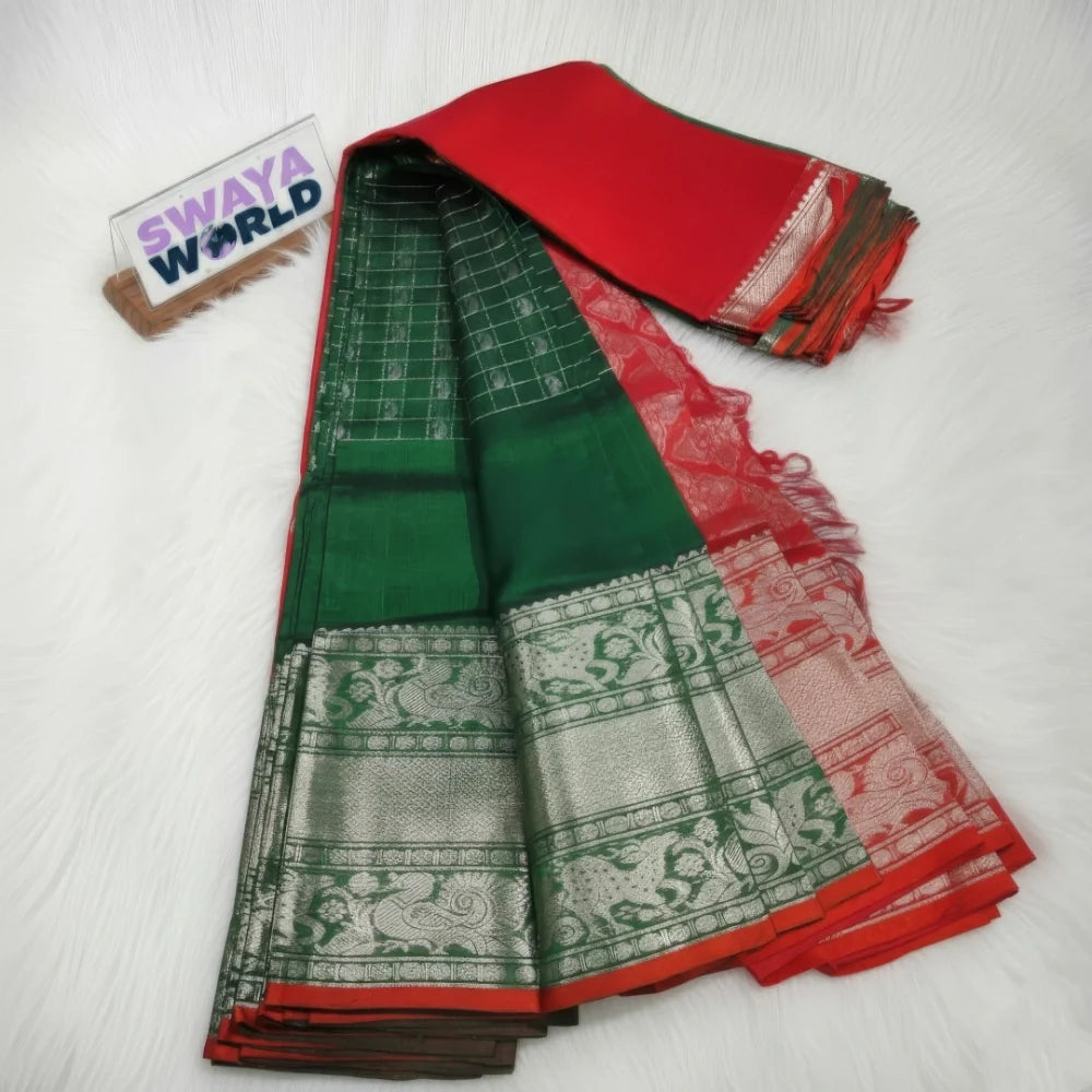 Green and red saree with a 'Swaya World' brand tag on a white background