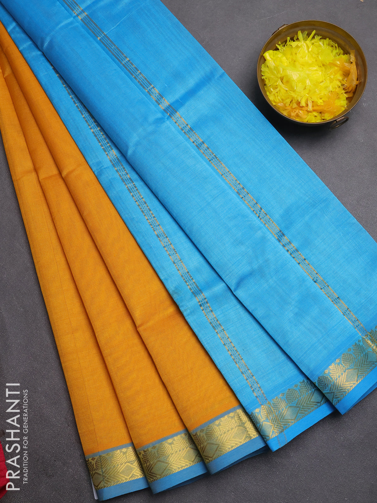 Silk cotton saree mustard yellow and cs blue with plain body and zari woven border