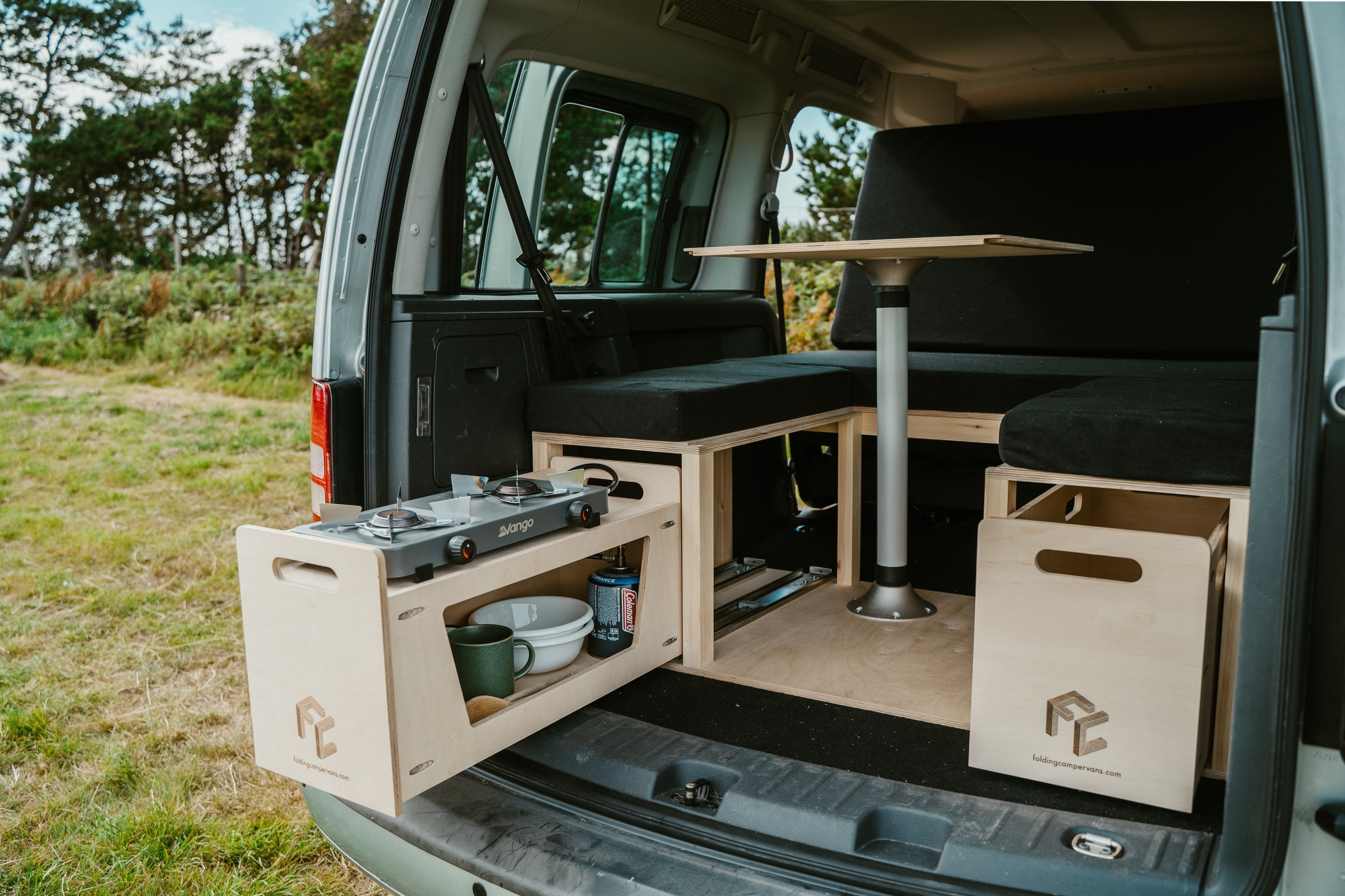 Premium Micro Camper Conversion installed in van boot with pull-out kitchen drawer and storage box