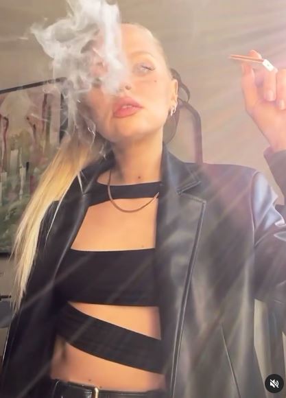 EastEnders' Hetti Bywater shows off her incredible figure in cut-out crop  top as she puffs on a vape