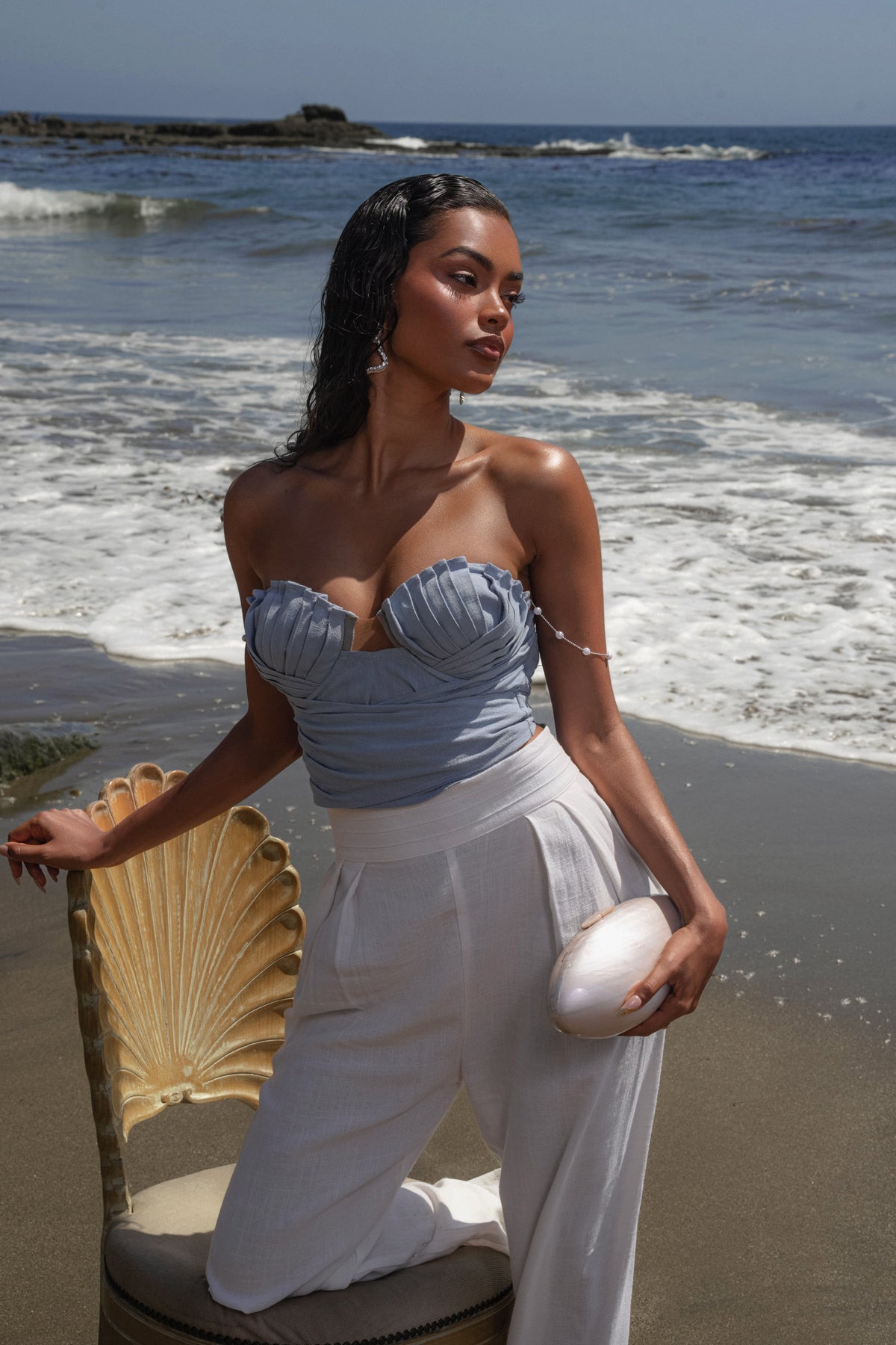 Blue Arielle bustier top from JLUXLABEL, featuring a fitted design and off-shoulder style, shown on a model.