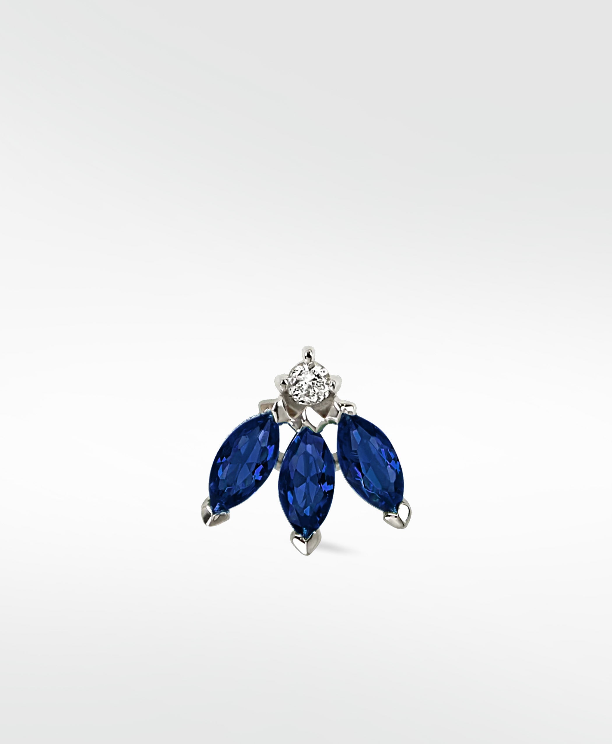 Lark & Berry Blossom Stud earring featuring three marquise-cut blue sapphires and a round diamond in a white gold setting.