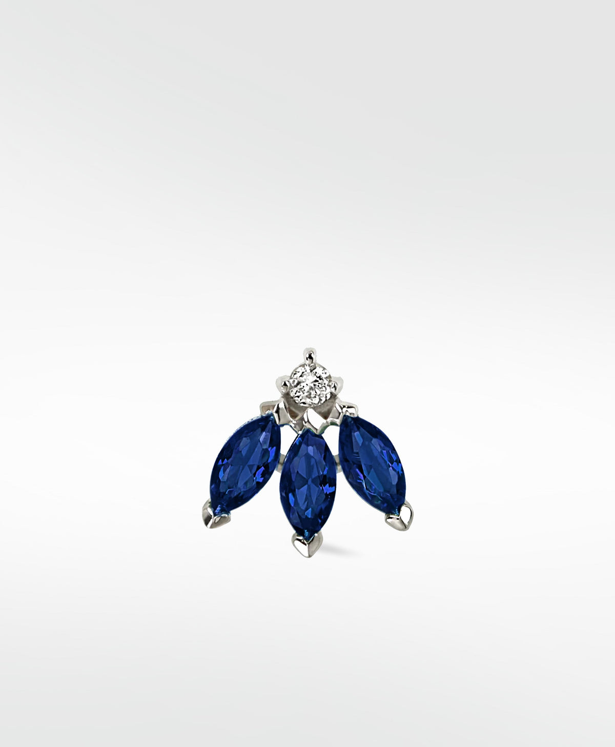 Lark & Berry Blossom Stud earring featuring three marquise-cut blue sapphires and a round diamond in a white gold setting.