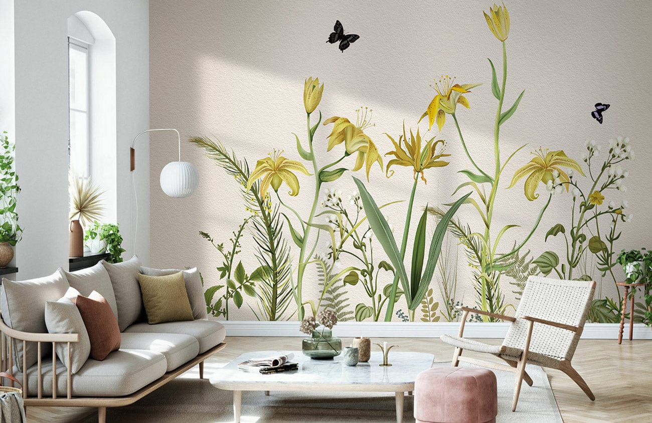 Vintage botanical mural wallpaper in soft yellow and green, with modern sofa, armchair, and decor.