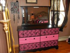 This dresser was originally all white. Just painted it black, pink drawers  (inside of them are also pink) and then hot glued lace to the drawers