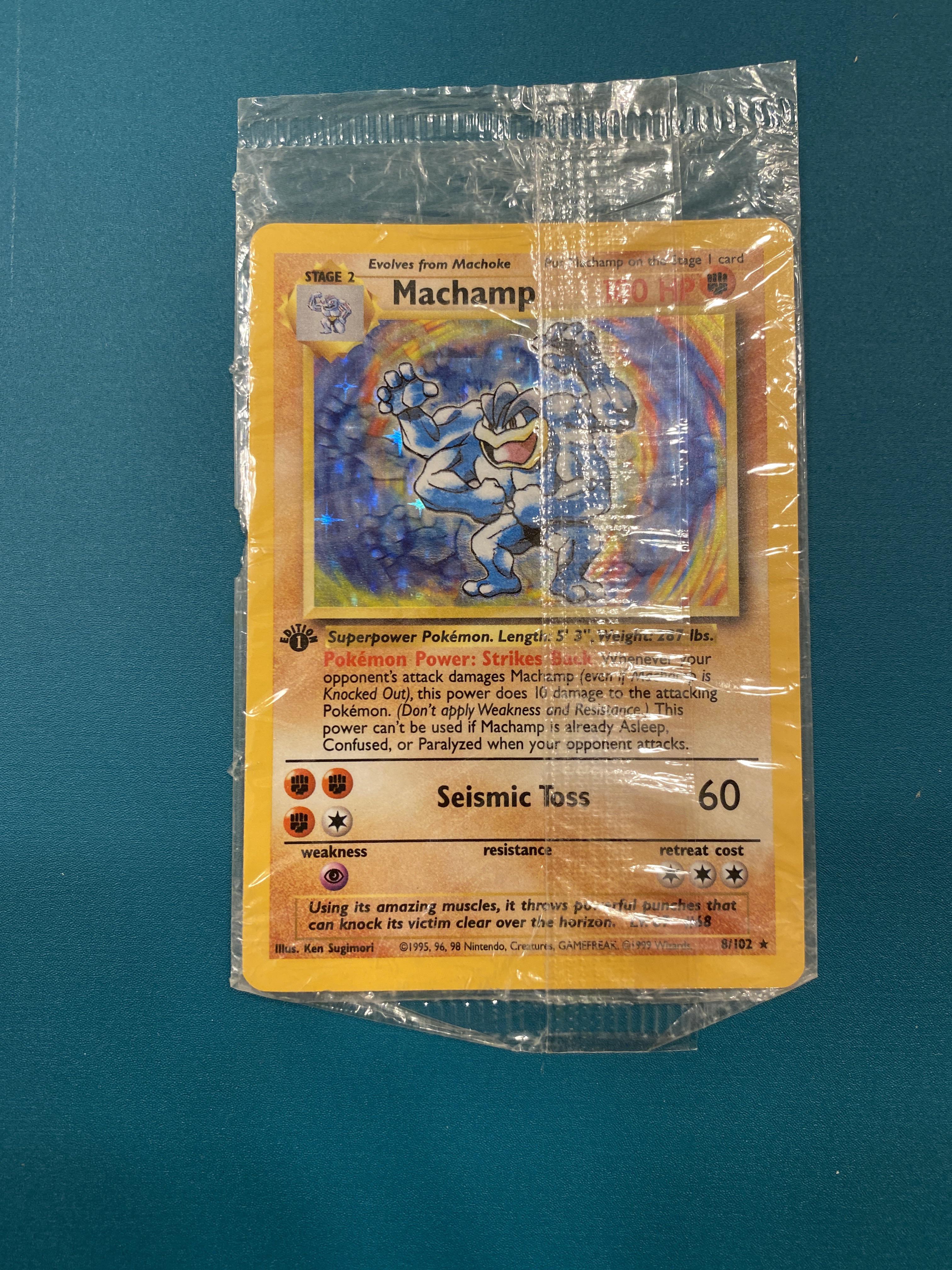 First edition holographic machamp still in original plastic wrap :  r/PokemonCardValue