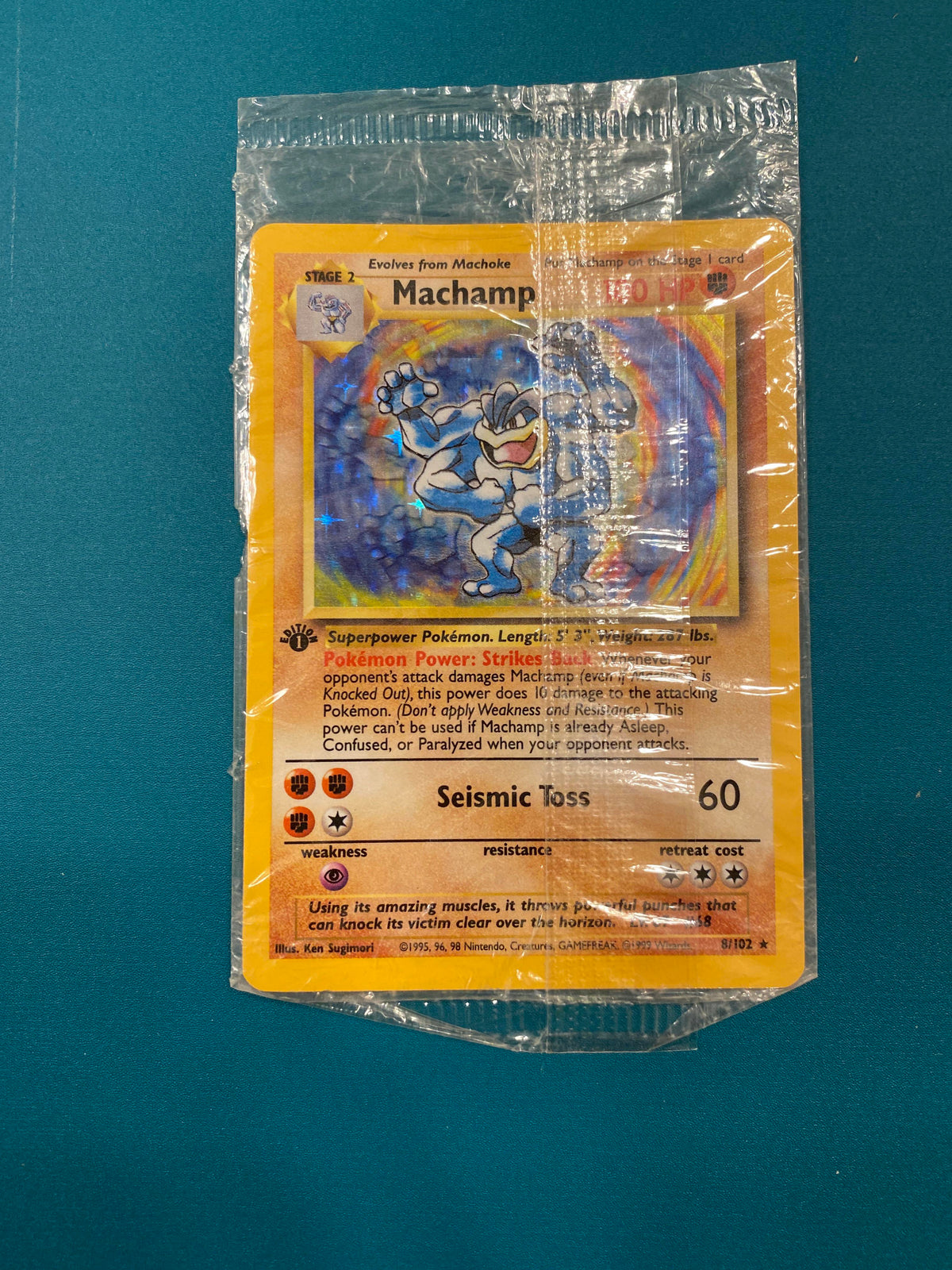 First edition holographic machamp still in original plastic wrap :  r/PokemonCardValue