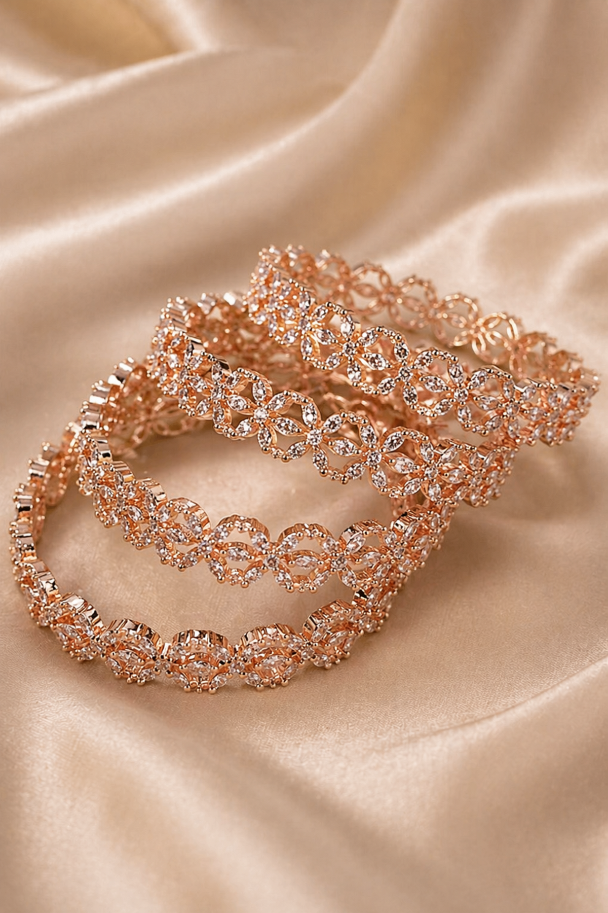floral open bangle with clear stones on soft fabric
