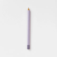 Tom's Studio Lumos Pro Single in Lilac (pale purple), fineline tip exposed, cap posted, on textured paper