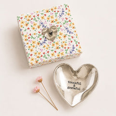 Silver heart shaped trinket dish with “thankful & grateful” quote, styled with floral gift box packaging.