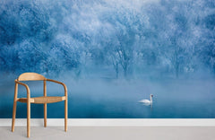 Ethereal Winter Wonderland mural wallpaper with swan, wooden chair, light flooring; serene room setting.