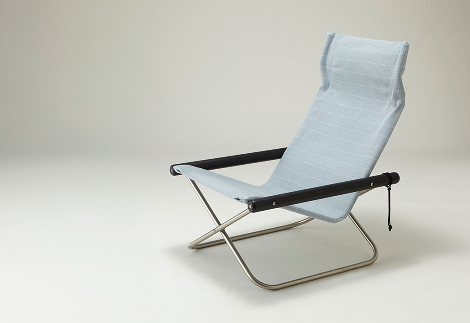 designed by rika kawato, the nychair x shikiri chair in blue grey with charcoal black oak arms