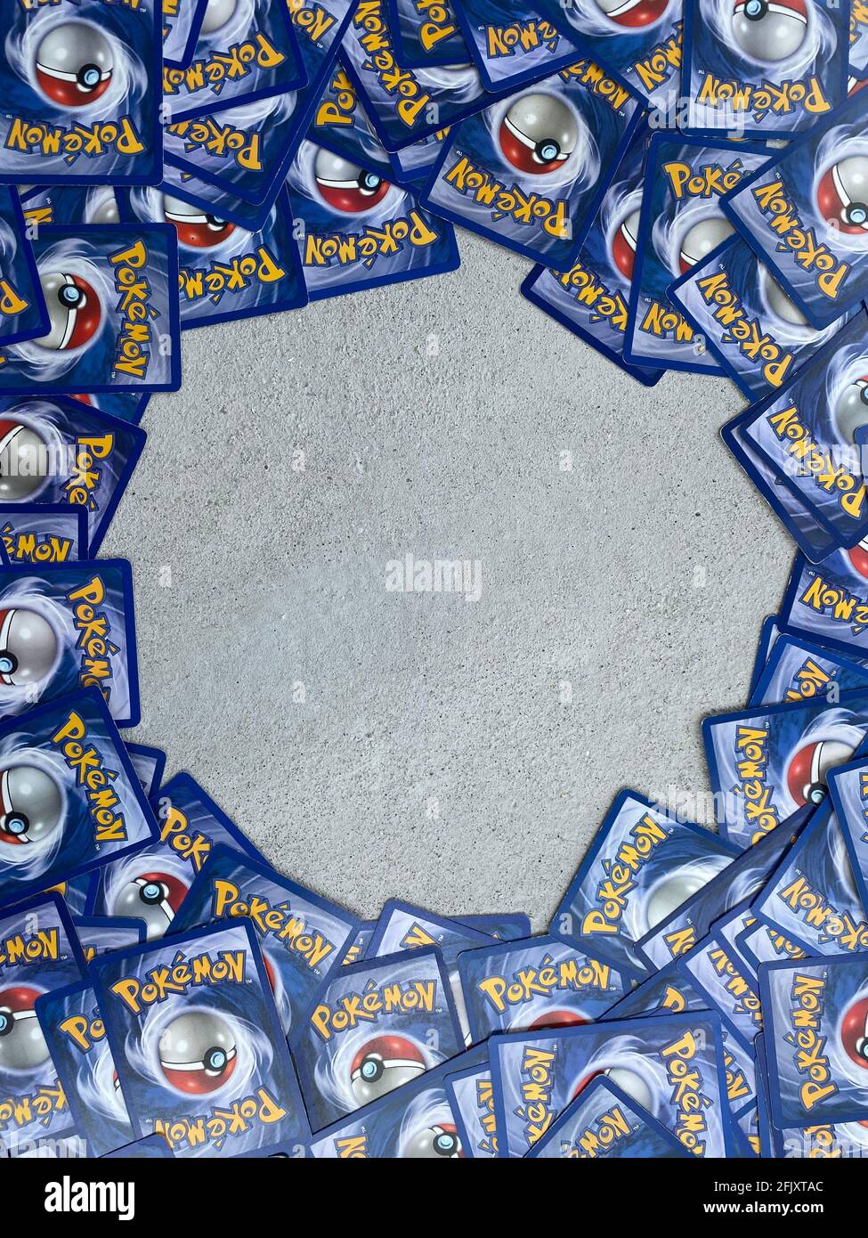Pokemon card laying in a circle with an empty center. Pokemon trading cards Stock Photo